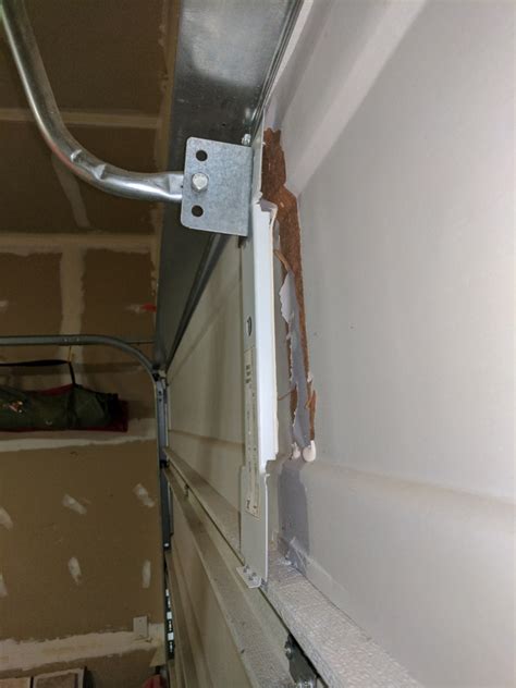 garage door opener arm bracket near metal|garage door bracket ripped off.